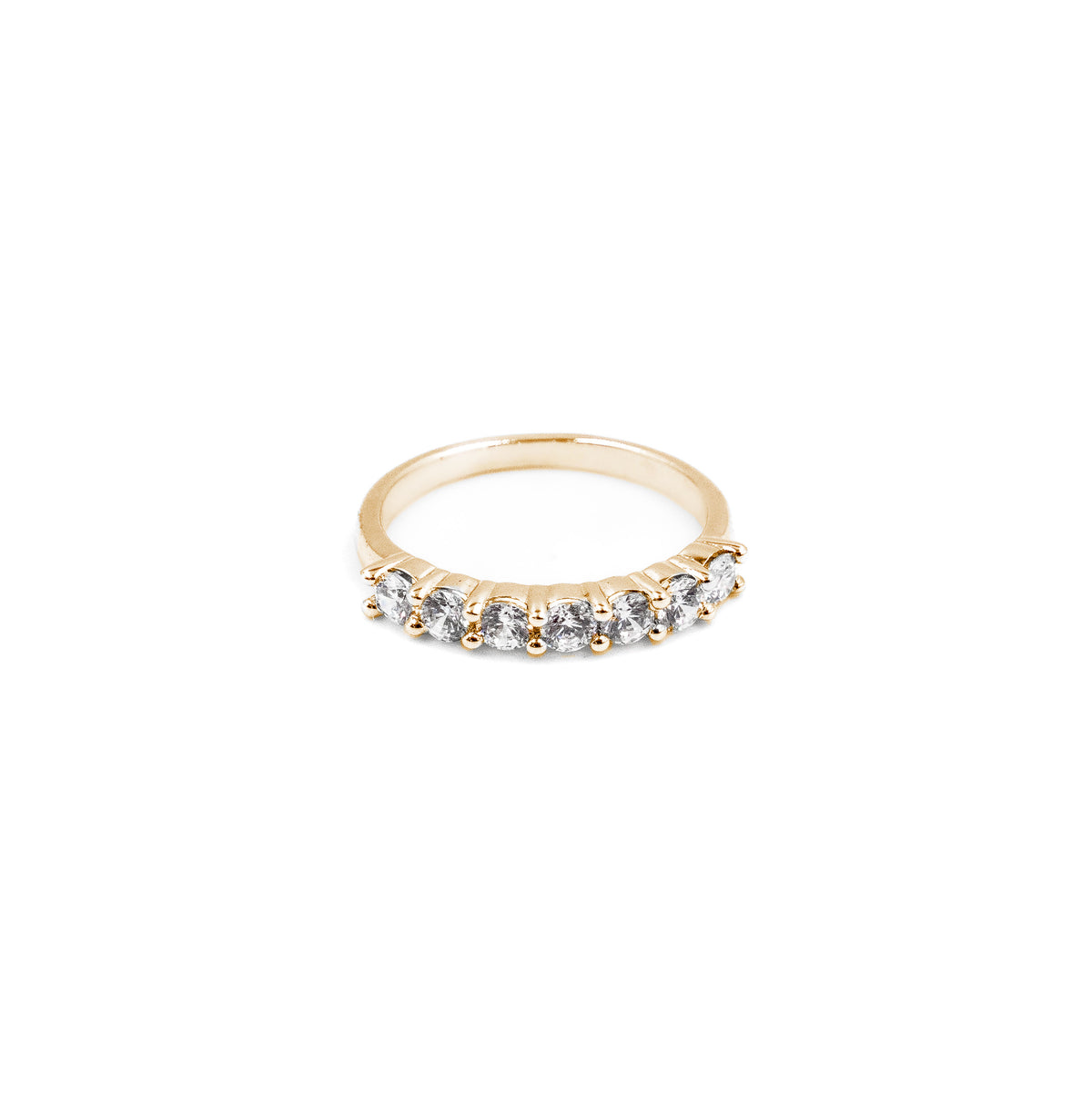 A luxurious fine jewelry dainty stacking ring in gold, adorned with seven dazzling diamonds, designed for stacking or wearing solo to add elegance to any look.