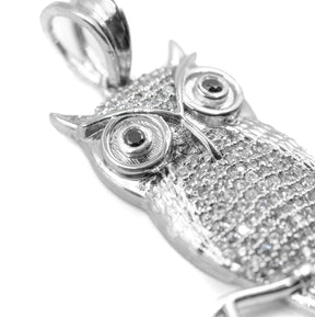 Close-up zoom of the Owl Pendant featuring diamonds, showcasing the brilliance and intricate detailing of the pendant's design.