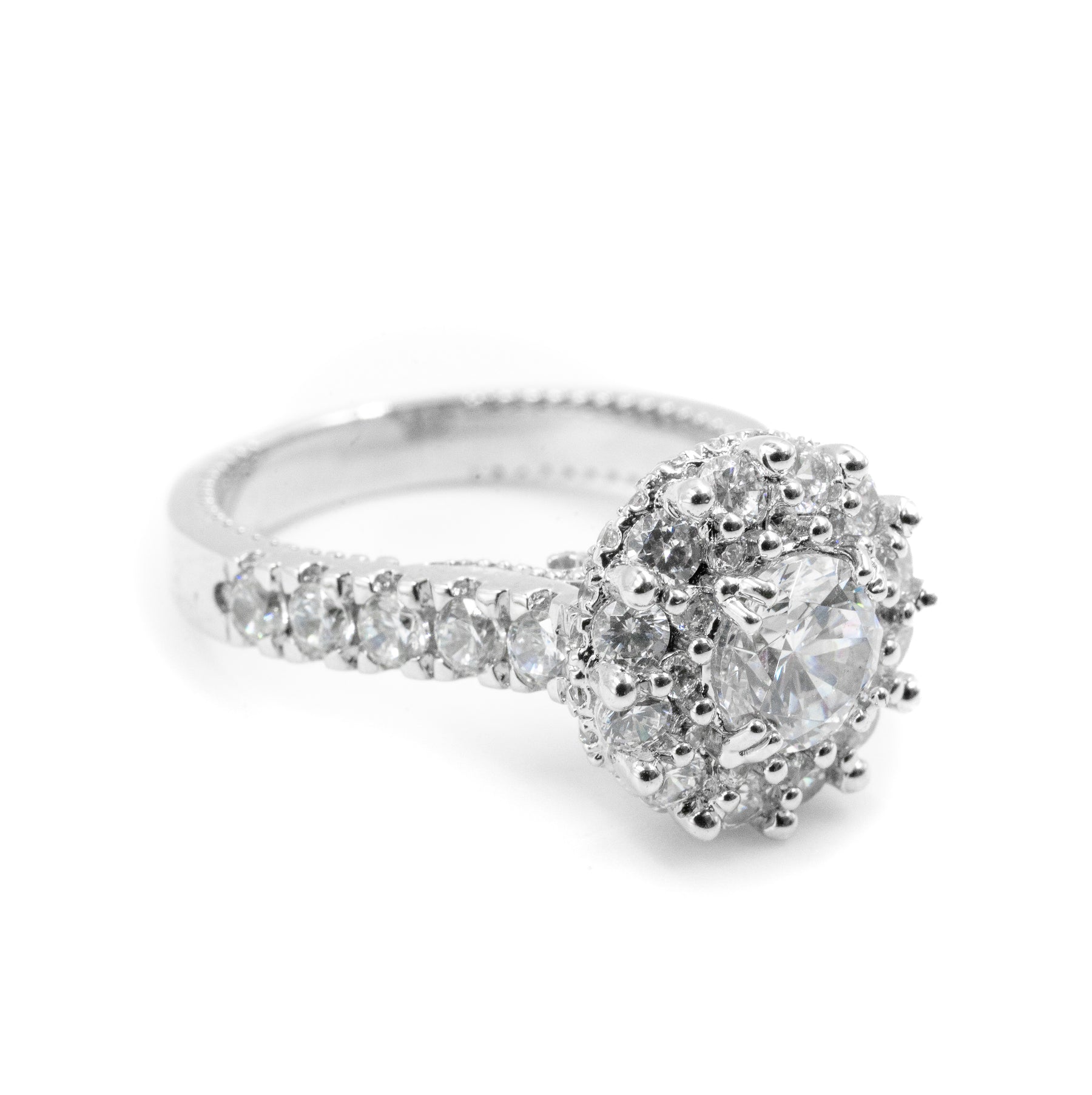 Left-side view of the Round Two-Tier Halo Diamond Ring in 925 silver, showcasing the elegant double halo design and sparkling diamonds from a refined angle