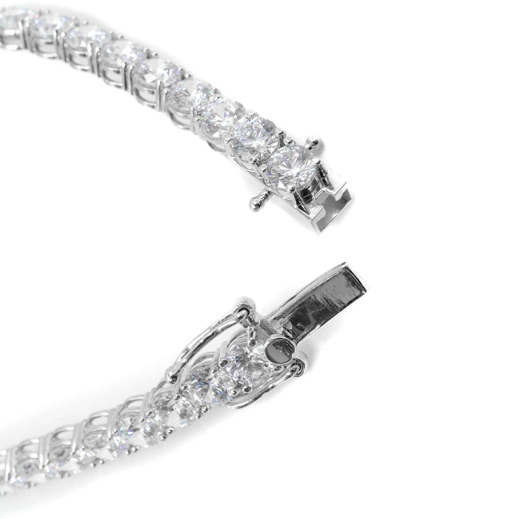 Close-up zoom view of the open lock clasp on a silver diamond tennis bracelet, showcasing fine craftsmanship and secure fastening mechanism. Luxury jewelry by Carat.Luxury.